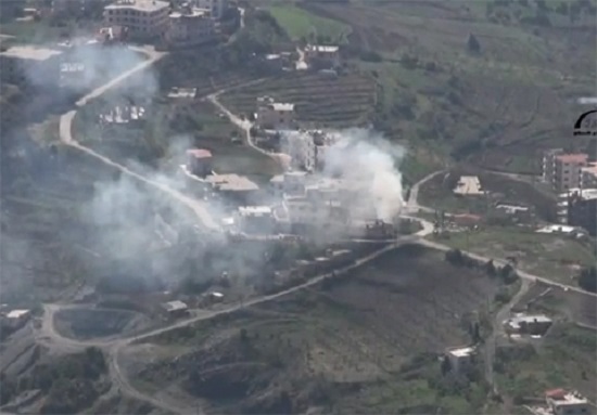 Smoke rises from the town center in Kessab after days of attacks by extremist militants crossing over from Turkey