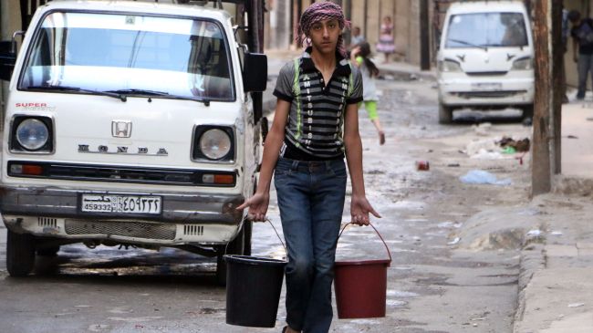A Syrian boy carries buckets of water in Aleppo on May 10, 2014 after militants cut water supplies into the city. 