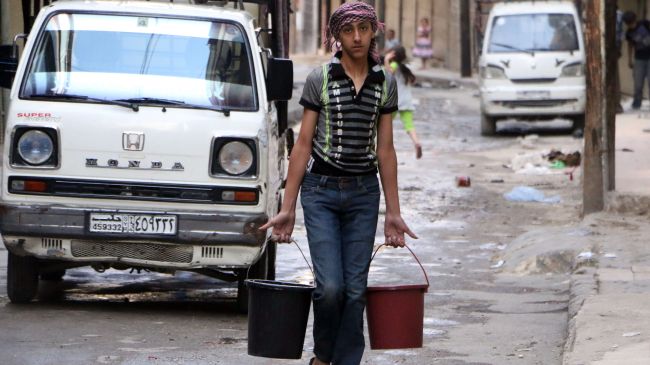 A Syrian boy carries buckets of water in Aleppo on May 10, 2014 after militants cut water supplies into the city.